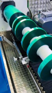 Slitting PET silicone tape log rolls to customer width