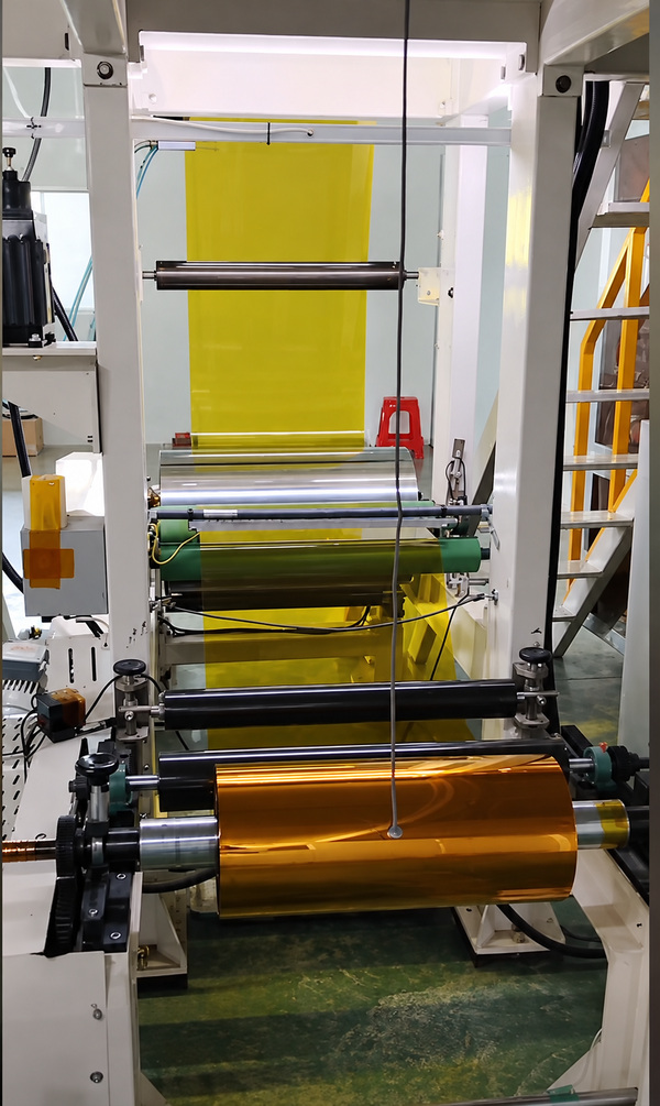 Coating adhesive onto polyimide film